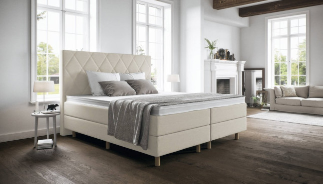 Boxspringbett Paula 180 x 200 cm mit Kopfteil Beatrix mit Seitenabstand. Runde Chromfüße. 